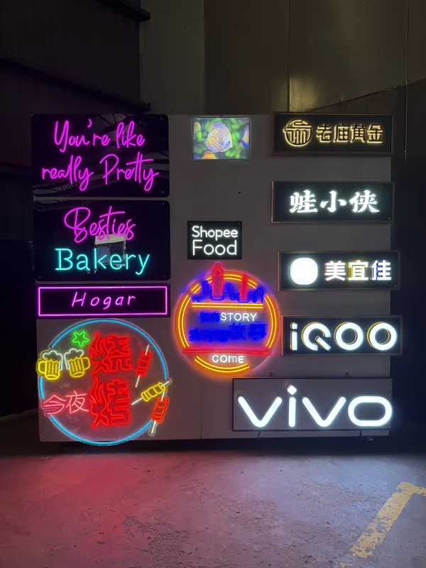 Neon script and Chinese-character neon on cut acrylic.